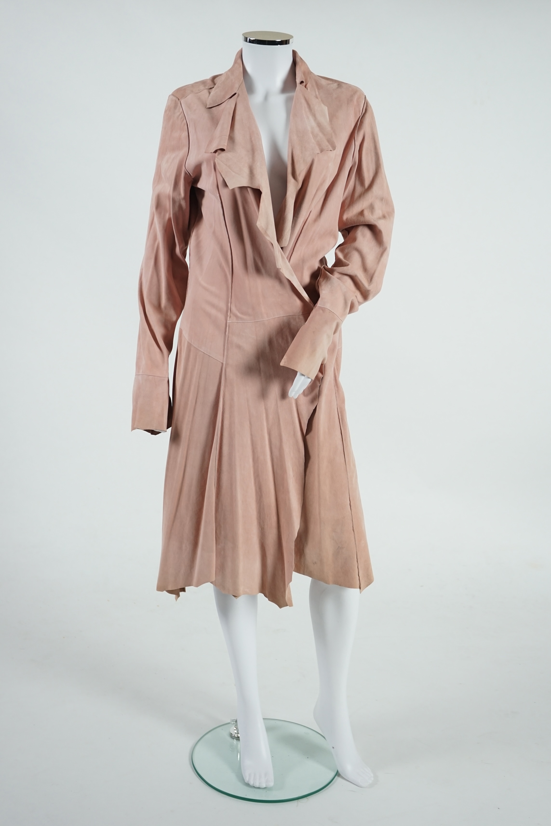 A lady's Angela Caputi silk cream skirt and blouse with fruit design size 46, a Ted Baker white lightweight cardigan with leaf design to the back size 4, a Rawhide dusky pink long laser cut coat size 14 and a Georgina vo